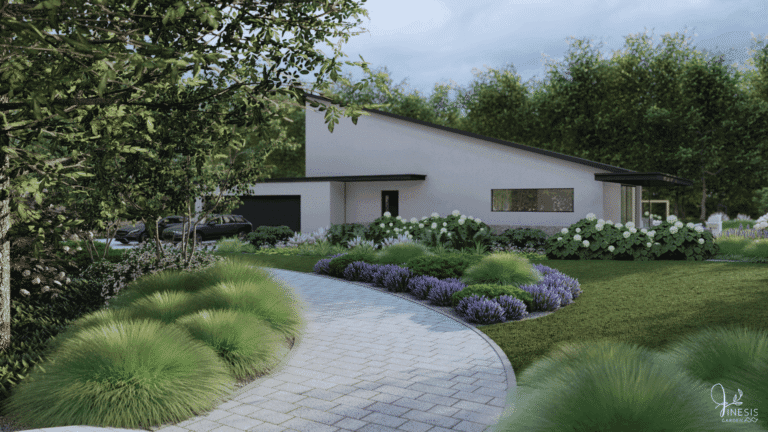 Kostka brukowa na podjazd otoczona rabatami bylinowymi i trawnikiem.