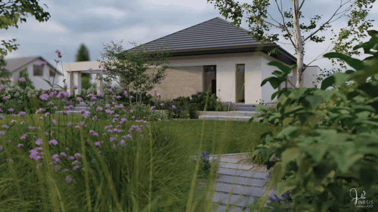 Ścieżka z płyt betonowych układanych z odstępem wśród roślin i traw ozdobnych.