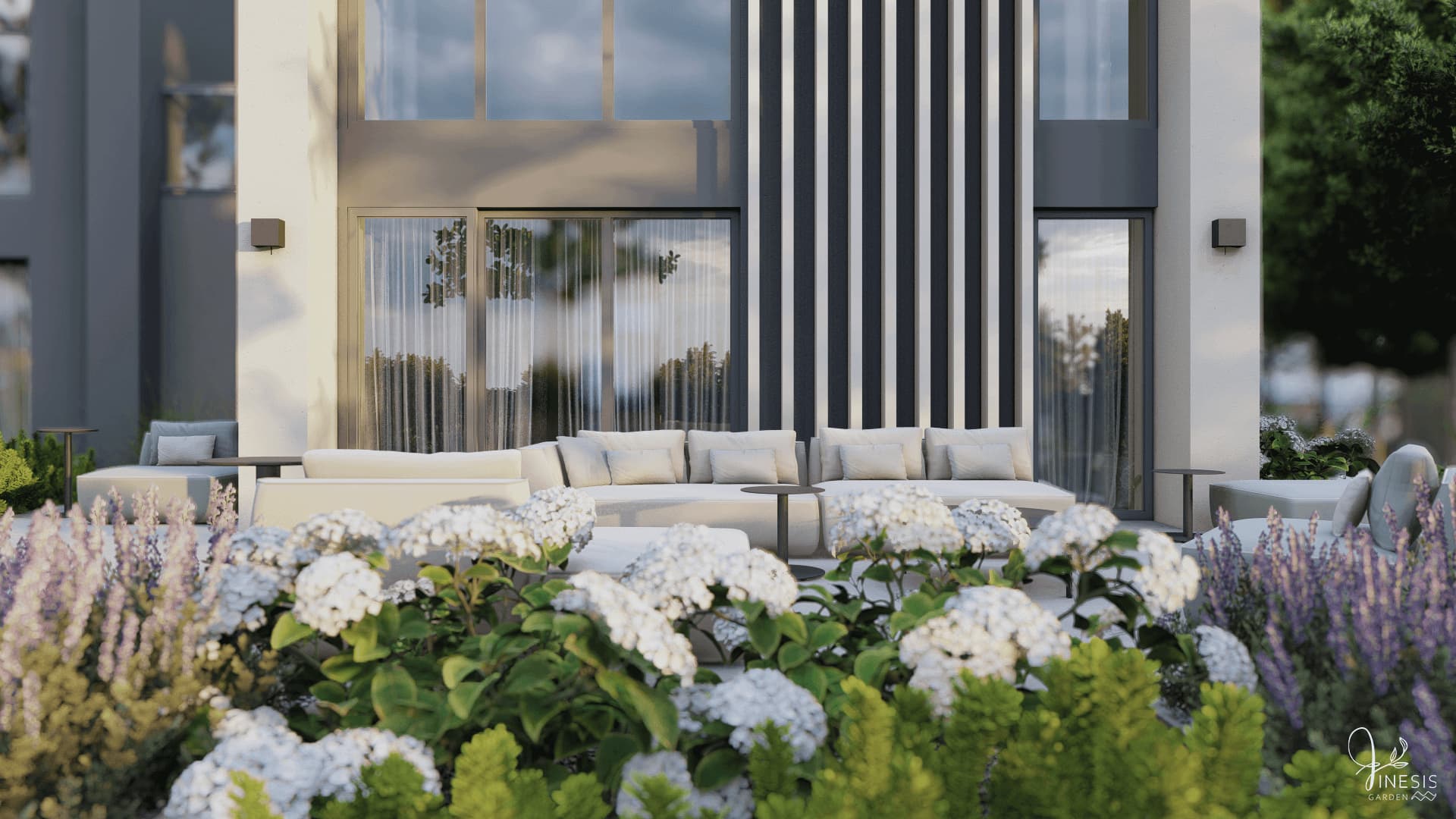 przytulny taras ogrodowy z sofą wypoczynkową, rabatą hortensji i ozdobnymi trawami w nowoczesnym ogrodzie przy domu
